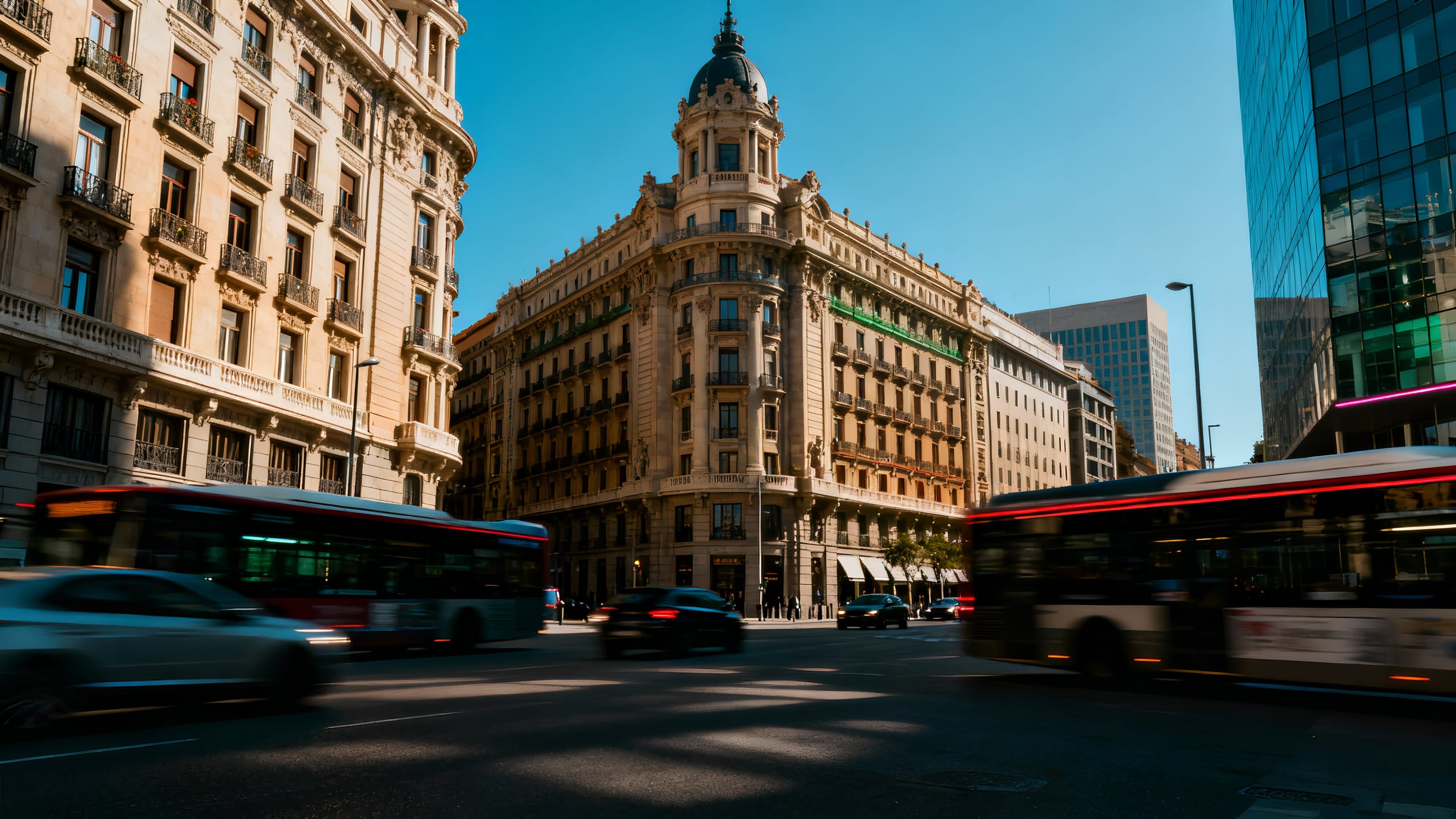 Historic Madrid building lit above Gran Vía.